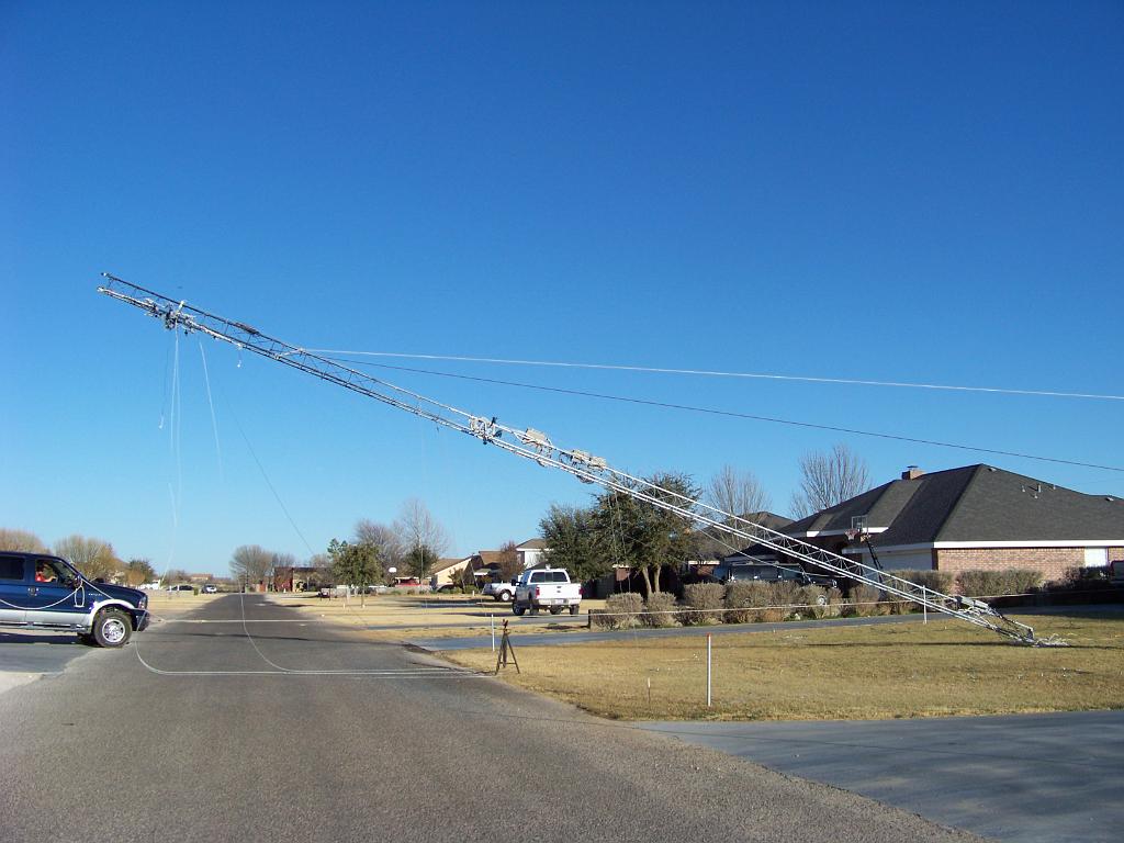 2009-03-30 Kodak 082.jpg - Frame 3. The pipe stand we had set to eventually sit it on has in the worst position. The tower slams into it, bending two sections. The star we had left on the top smashes into the ground.